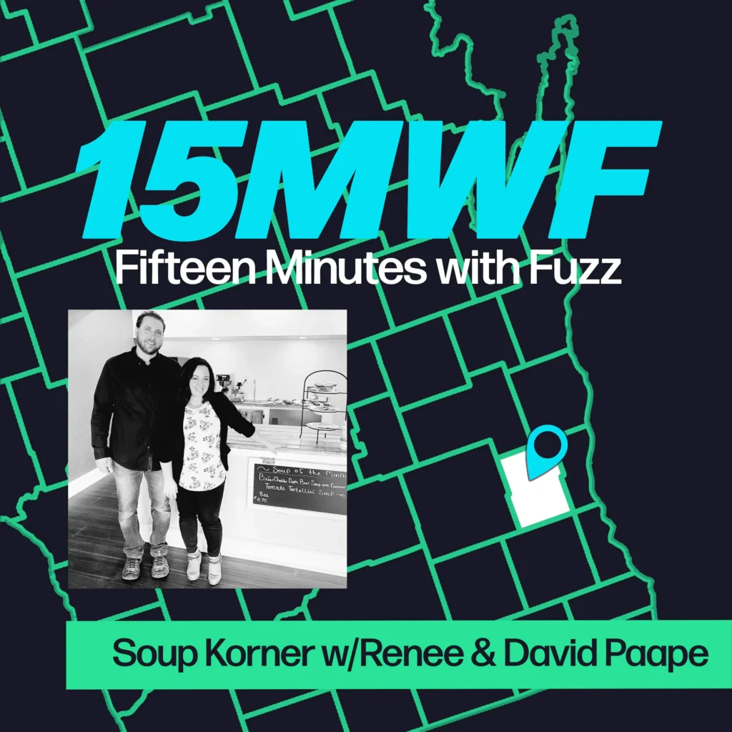 A graphic for “Fifteen Minutes with Fuzz” features a background map outline in green on a dark blue background. The title “15MWF” in large teal letters is at the top, with “Fifteen Minutes with Fuzz” in white letters underneath. Below the title, there is an inset black-and-white photo of a man and woman standing in a soup shop, smiling at the camera. At the bottom, a green label reads “Soup Korner w/Renee & David Paape.”