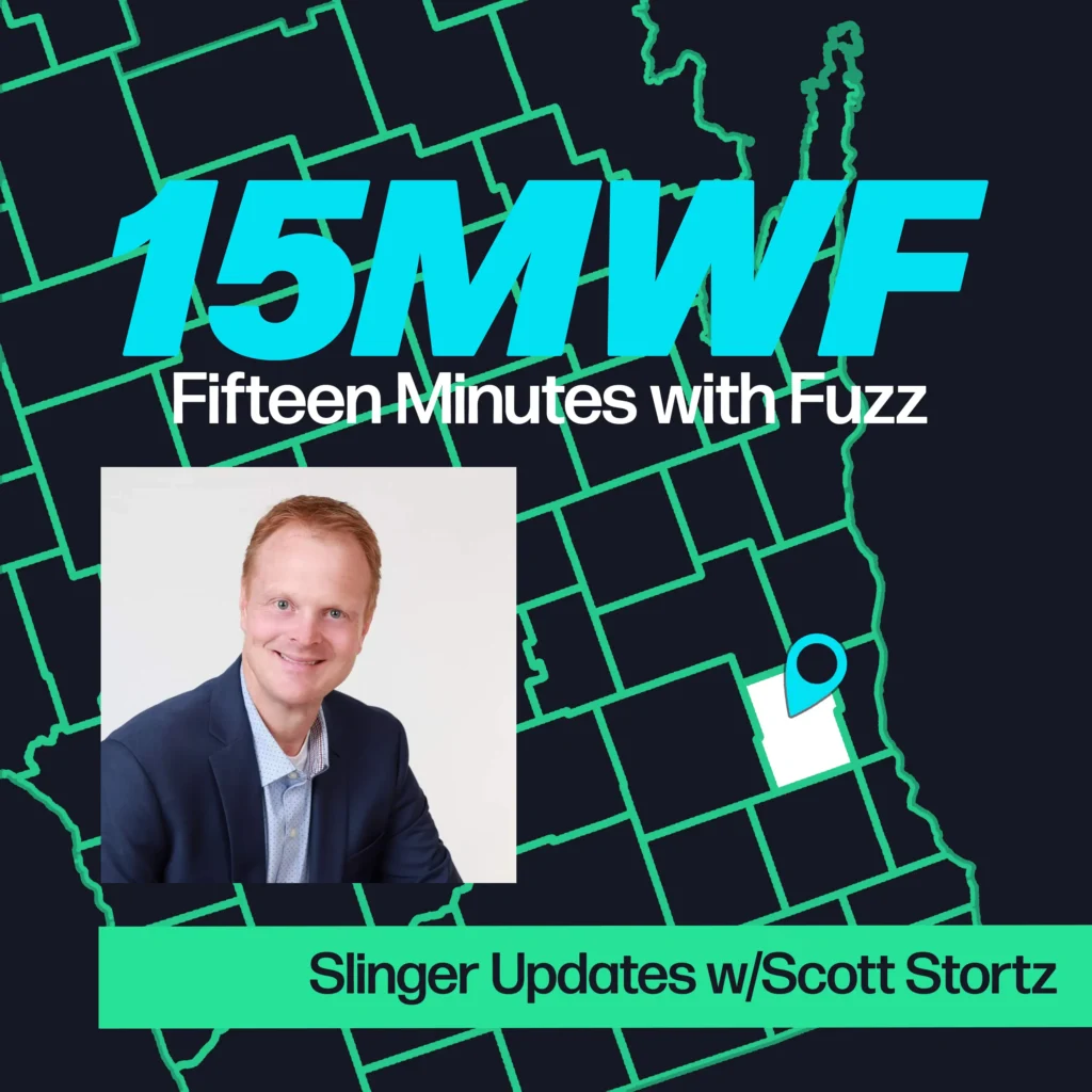 A graphic for “Fifteen Minutes with Fuzz” features a background map outline in green on a dark blue background. The title “15MWF” in large teal letters is at the top, with “Fifteen Minutes with Fuzz” in white letters underneath. Below the title, there is an inset photo of Scott Stortz, wearing a navy blue blazer and white shirt, with a white background. At the bottom, a green label reads “Slinger Updates w/Scott Stortz.”