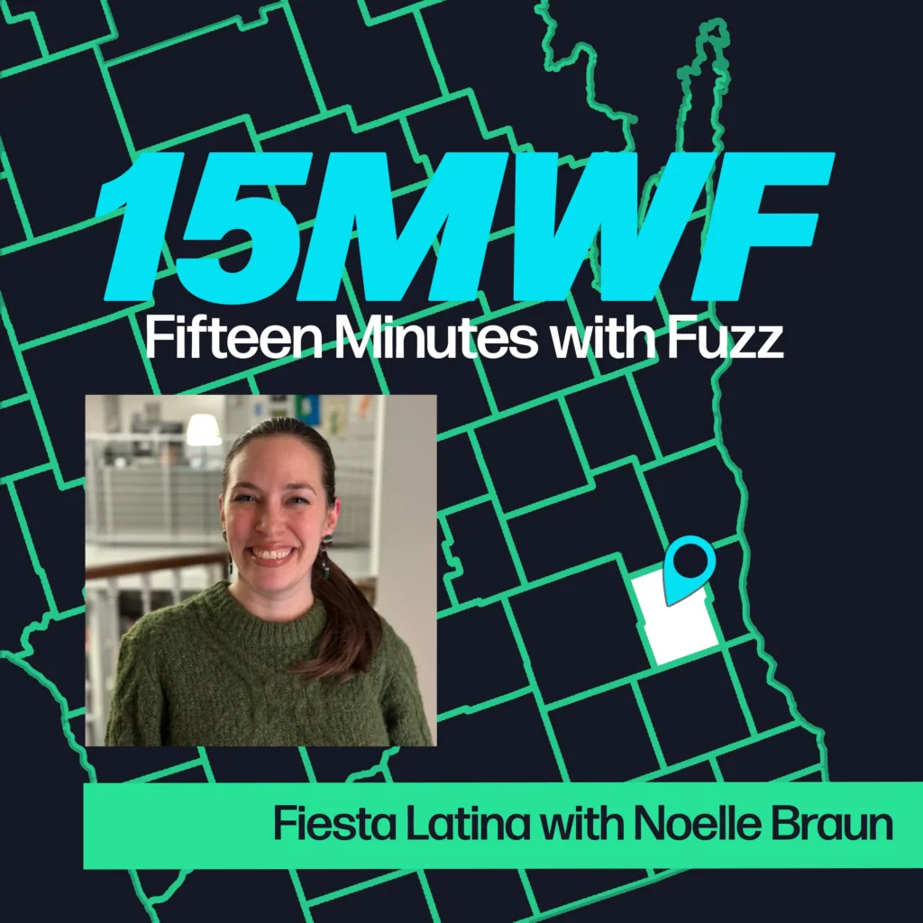 A promotional image for “Fifteen Minutes with Fuzz” featuring a map of Washington County, Wisconsin. The title “15MWF Fifteen Minutes with Fuzz” is displayed prominently at the top. Below it, there is an image of Noelle Braun smiling, dressed in a green sweater, with the text “Fiesta Latina with Noelle Braun” at the bottom.