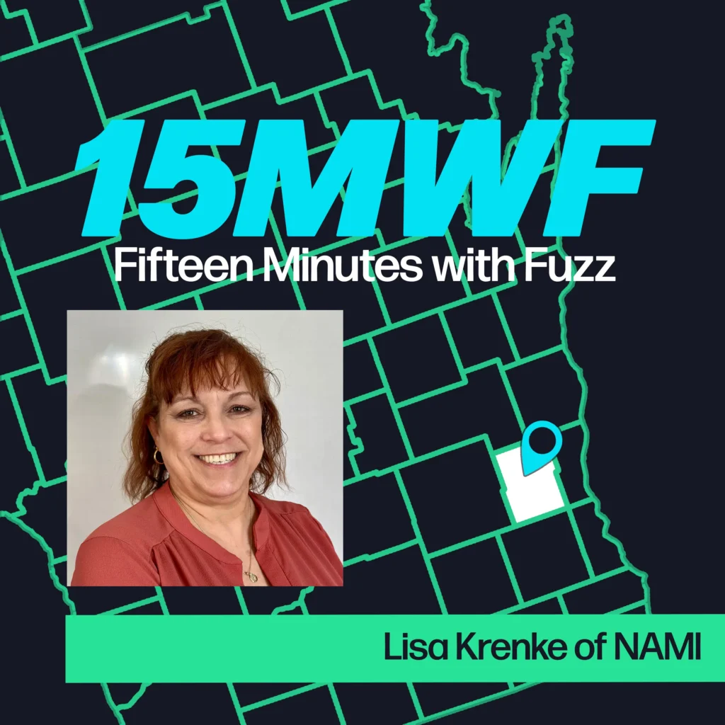 The cover art features a map highlighting Washington County, Wisconsin, marked with a blue pin to indicate the local focus of the podcast. The podcast title “15 Minutes with Fuzz” is prominently displayed in a bold, modern font. The guest’s name, Lisa Krenke of NAMI, is written below her photograph on the right side.