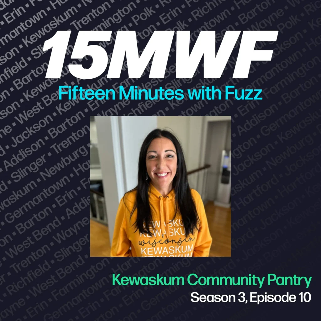 15MWF - Fifteen Minutes with Fuzz podcast cover art for Season 3, Episode 10 featuring a representative from the Kewaskum Community Pantry. The background includes names of various locations within Washington County, emphasizing the local focus of the podcast. The guest is smiling and wearing an orange hoodie with ‘Kewaskum, Wisconsin’ printed on it.