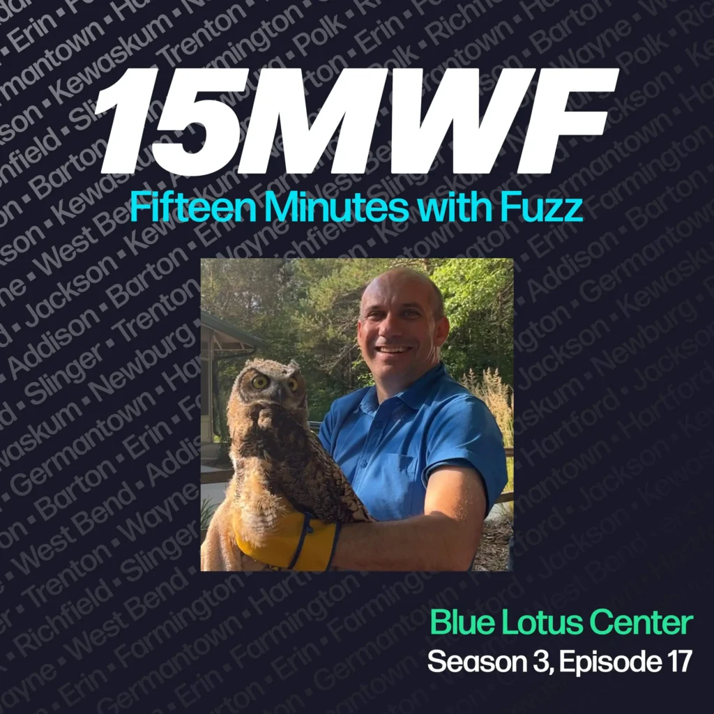 15MWF - Fifteen Minutes with Fuzz podcast cover art for Season 3, Episode 17 featuring a guest from the Blue Lotus Center. The background includes names of various locations within Washington County, emphasizing the local focus of the podcast. The guest is smiling and holding an owl while wearing a blue polo shirt and yellow glove.