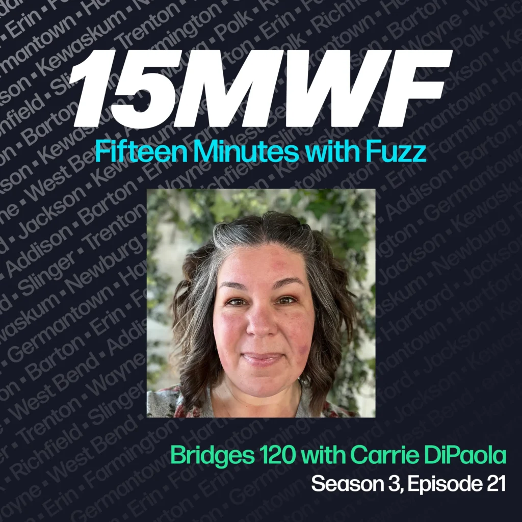 15MWF - Fifteen Minutes with Fuzz podcast cover art for Season 3, Episode 21 featuring Bridges 120 with Carrie DiPaola. The background includes names of various locations within Washington County, emphasizing the local focus of the podcast. A close-up photo of Carrie DiPaola with a backdrop of greenery.