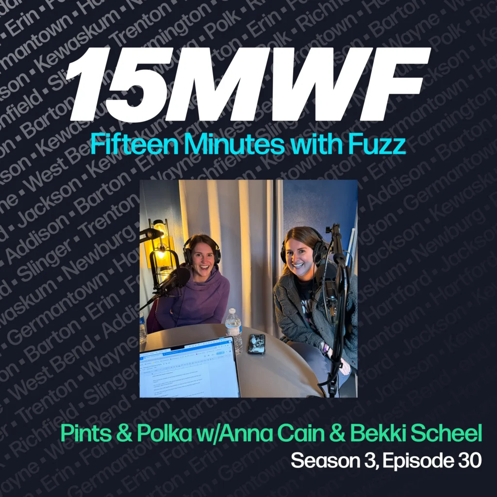 15MWF - Fifteen Minutes with Fuzz podcast cover art for Season 3, Episode 30 titled ‘Pints & Polka w/ Anna Cain & Bekki Scheel.’ The background includes names of various locations within Washington County, emphasizing the local focus of the podcast. A photo of Anna Cain and Bekki Scheel, smiling and seated in a podcast studio with microphones, is placed in the center.