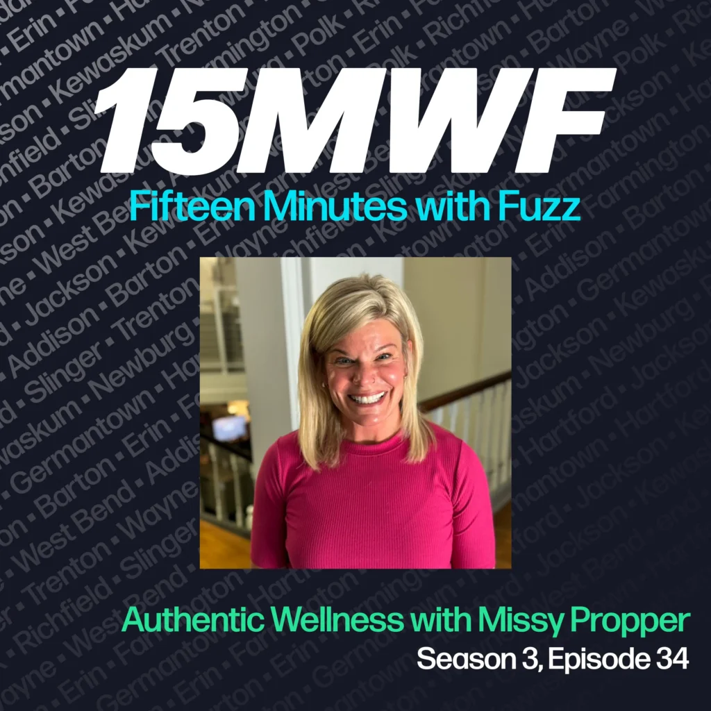 15MWF - Fifteen Minutes with Fuzz podcast cover art for Season 3, Episode 34 titled ‘Authentic Wellness with Missy Propper.’ The background includes names of various locations within Washington County, emphasizing the local focus of the podcast. A photo of Missy Propper, smiling and wearing a pink long-sleeve shirt, is placed in the center.